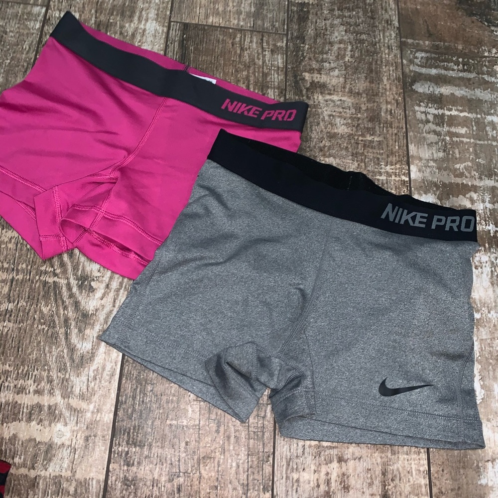 2 Nike pro shorts one is grey and one is pink